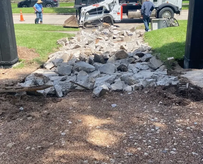 Demolition and debris removal during the driveway replacement