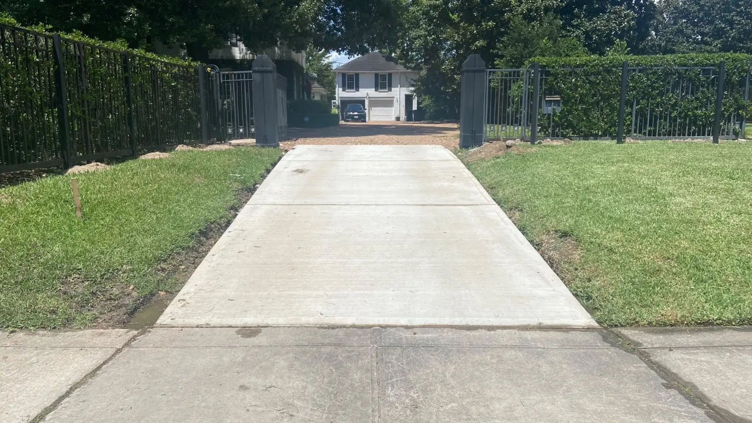 Completed reinforced concrete driveway entrance by F2 Building in River Oaks, Houston, Texas
